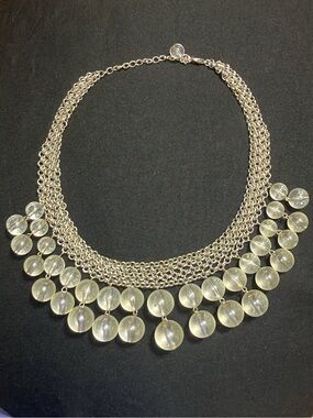 Vintage silver-tone chainmail statement necklace featuring dramatic dangling cle
